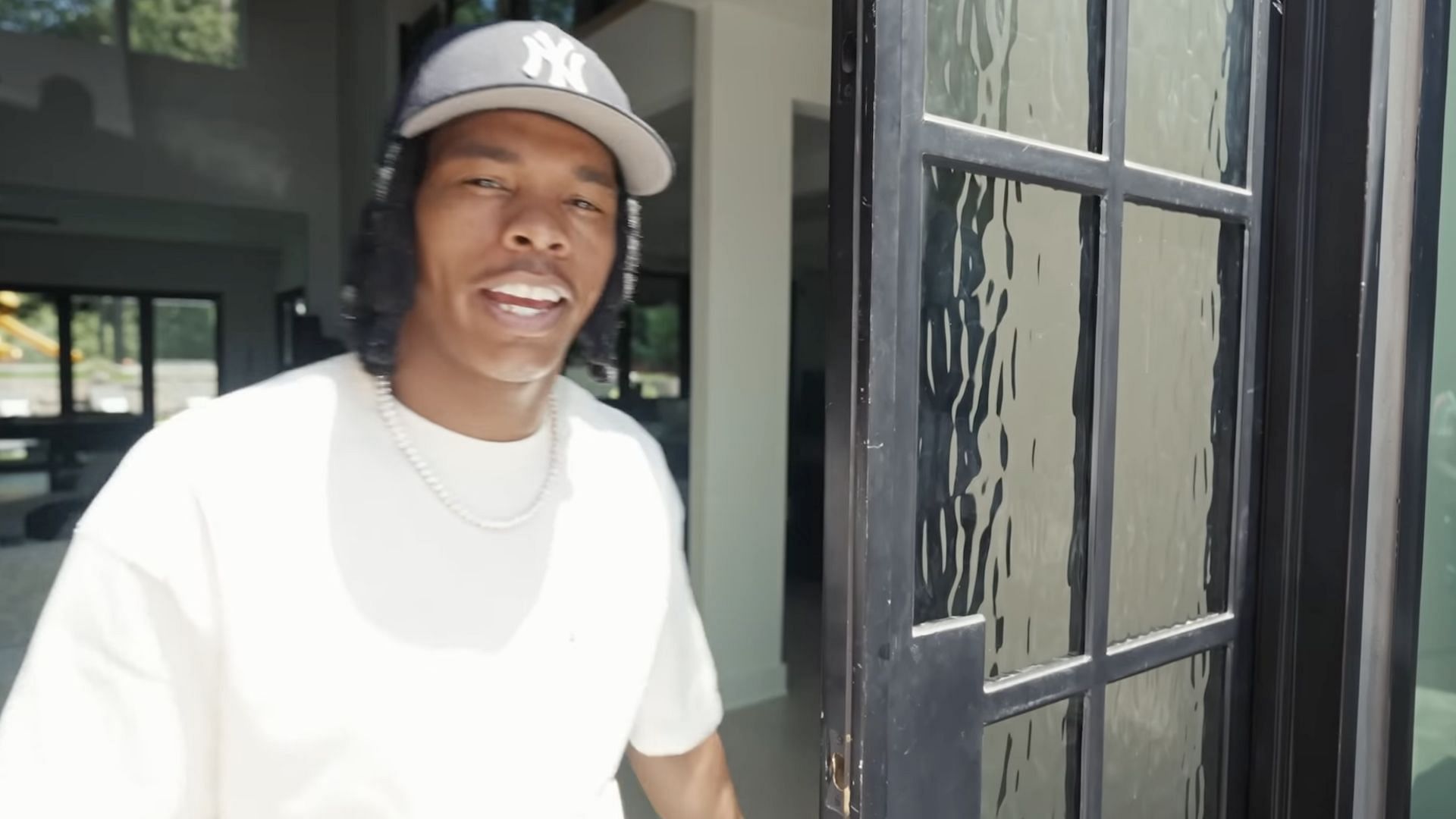 Lil Baby speaking to Architectural Digest about his new Atlanta &quot;Bachelor Pad&quot; (Image via YouTube/@Archdigest)