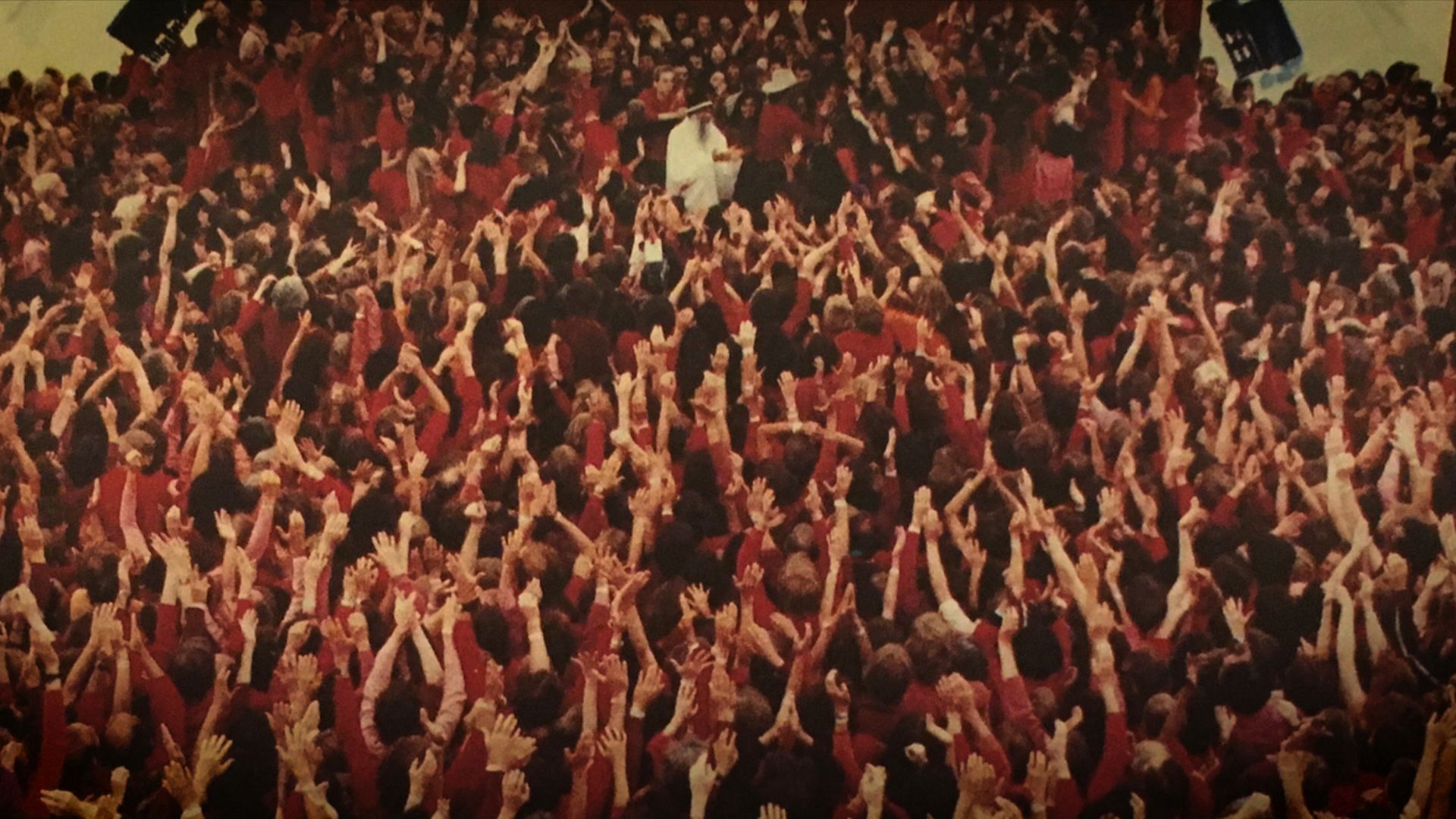 A gathering at Rajneeshpuram (Image via Netflix)