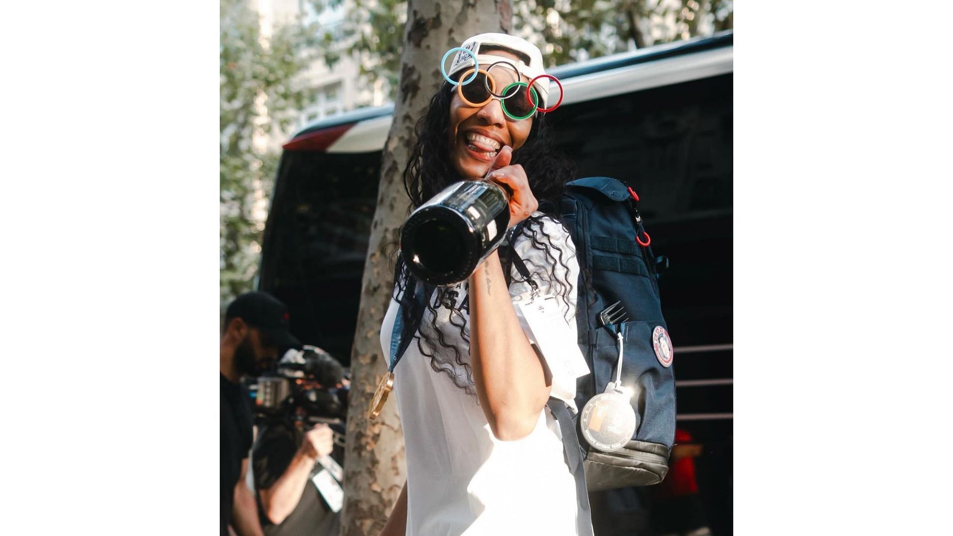 A'ja Wilson holding a bottle of champagne at the 2024 Paris Olympics. Image Credit: A'ja Wilson's Instagram account