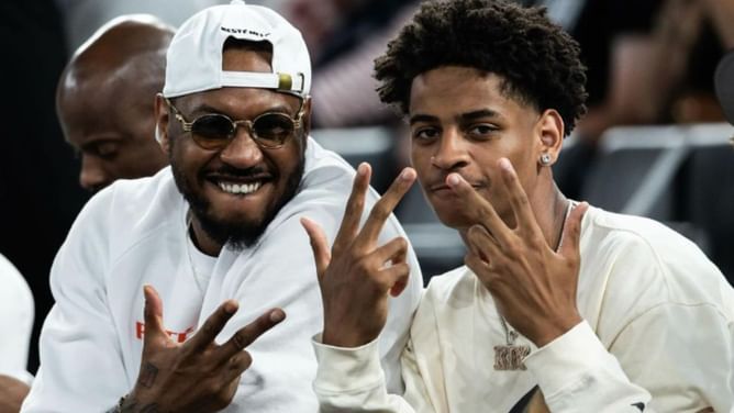 Carmelo Anthony and son Kiyan light up Nike's NY vs NY tournament after Paris getaway