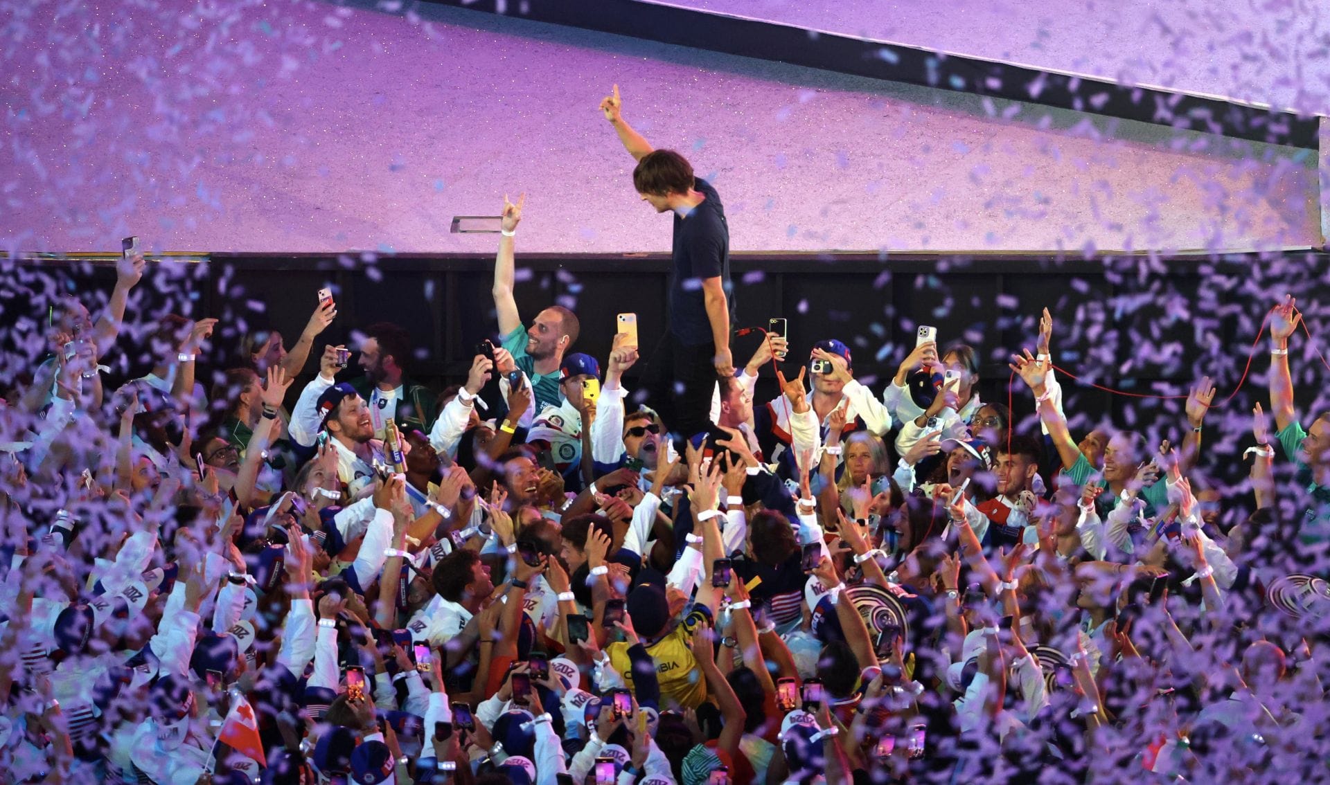 Thomas Mars of band "Phoenix" interacts with the athletes at the closing ceremony of the Paris Olympics - Getty Images