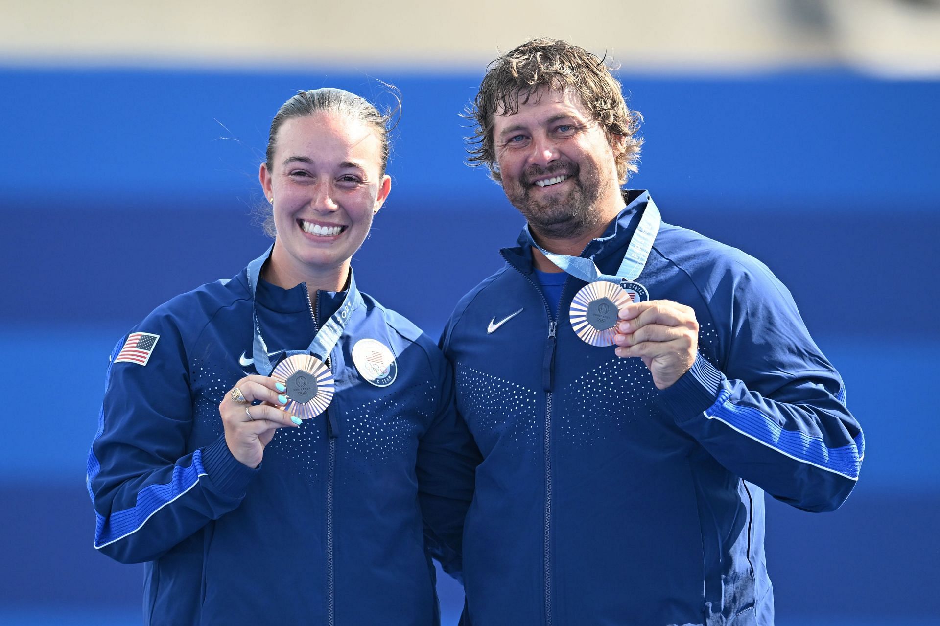 Casey Kaufhold and Brady Ellison from the USA celebrate bronze in the mixed team archery at the award ceremony at the 2024 Summer Olympics in Paris, France. (Photo via Getty Images)