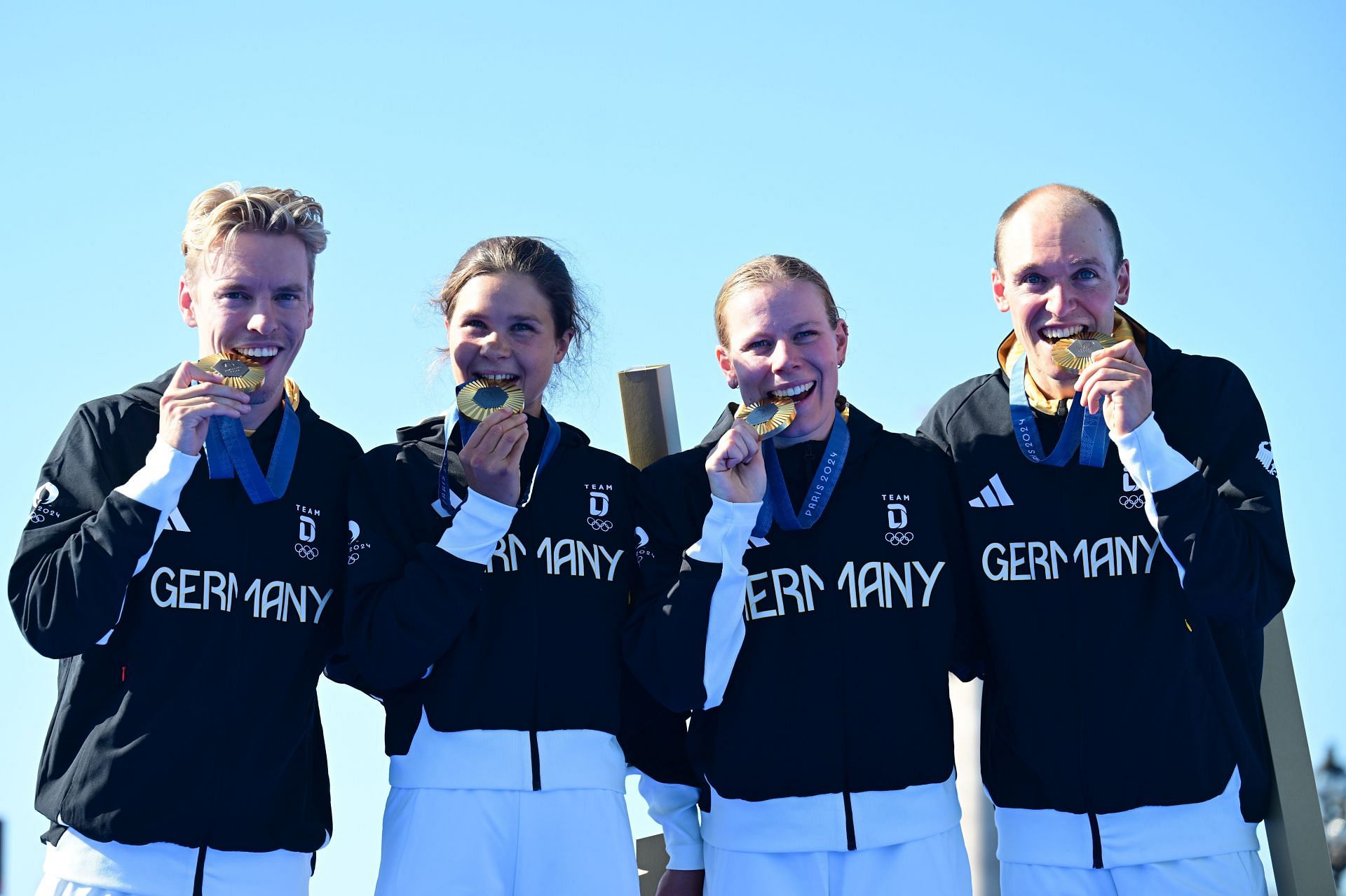 Tim Hellwig, Lisa Tertsch, Lasse Luehrs, and Laura Lindemann, pose after winning the Triathlon Mixed Relay at the 2024 Paris Olympics (Picture: Getty)