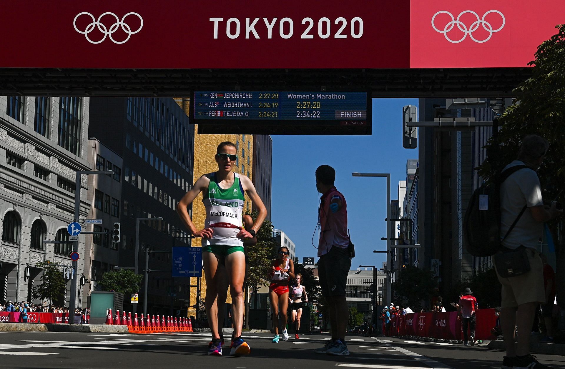 Why are women's marathon winners being awarded their medals at the