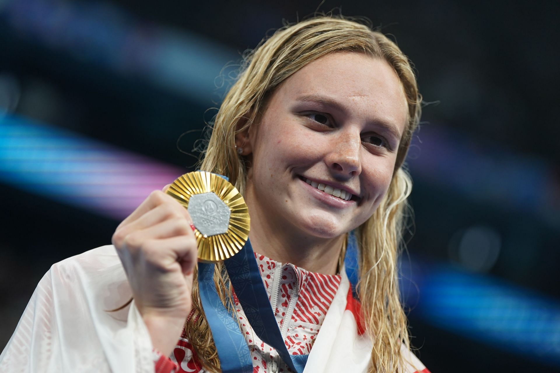 Summer Mcintosh from Canada reacts with her gold medal at the Olympic Games 2024 in Paris, France. (Photo via Getty Images)