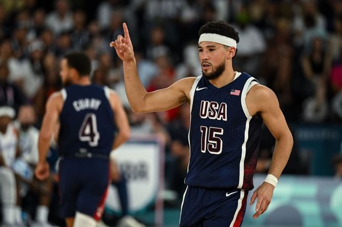 “Increasing his aura lately”- Fans impressed with Devin Booker after he leaves party club on a bike following gold medal win