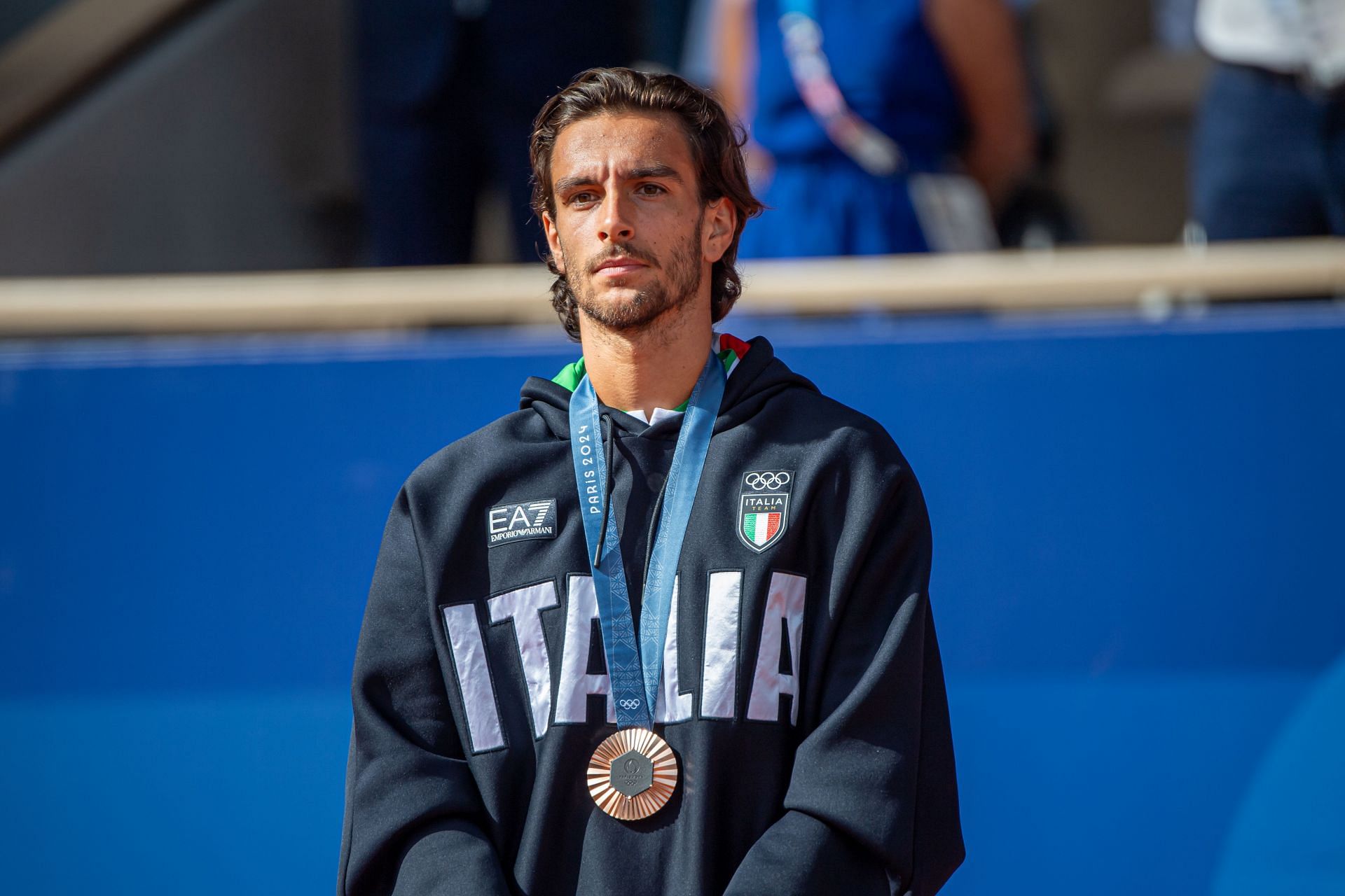 Lorenzo Musetti on the podium with his bronze medal at the Olympic Games Paris 2024. (Image: Getty)