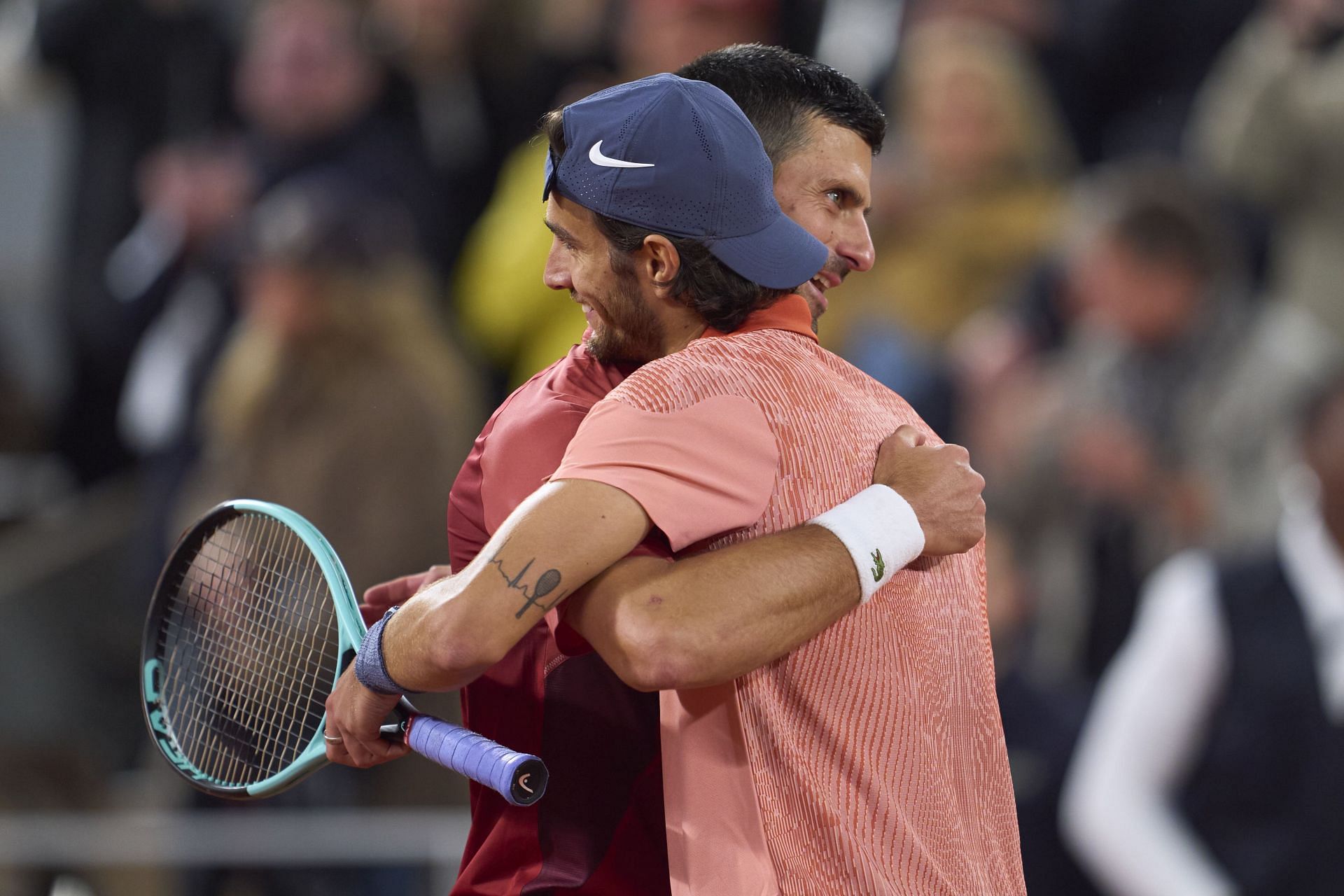 Novak Djokovic and Lorenzo Musetti at the 2024 French Open. (Image via Getty)