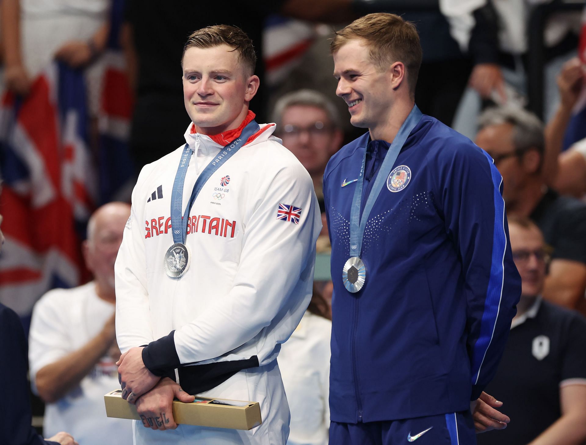 Adam Peaty of Great Britain with Nic Fink of USA after winning the silver medal in the men&#039;s 100m breaststroke at the 2024 Paris Olympics - Getty Images