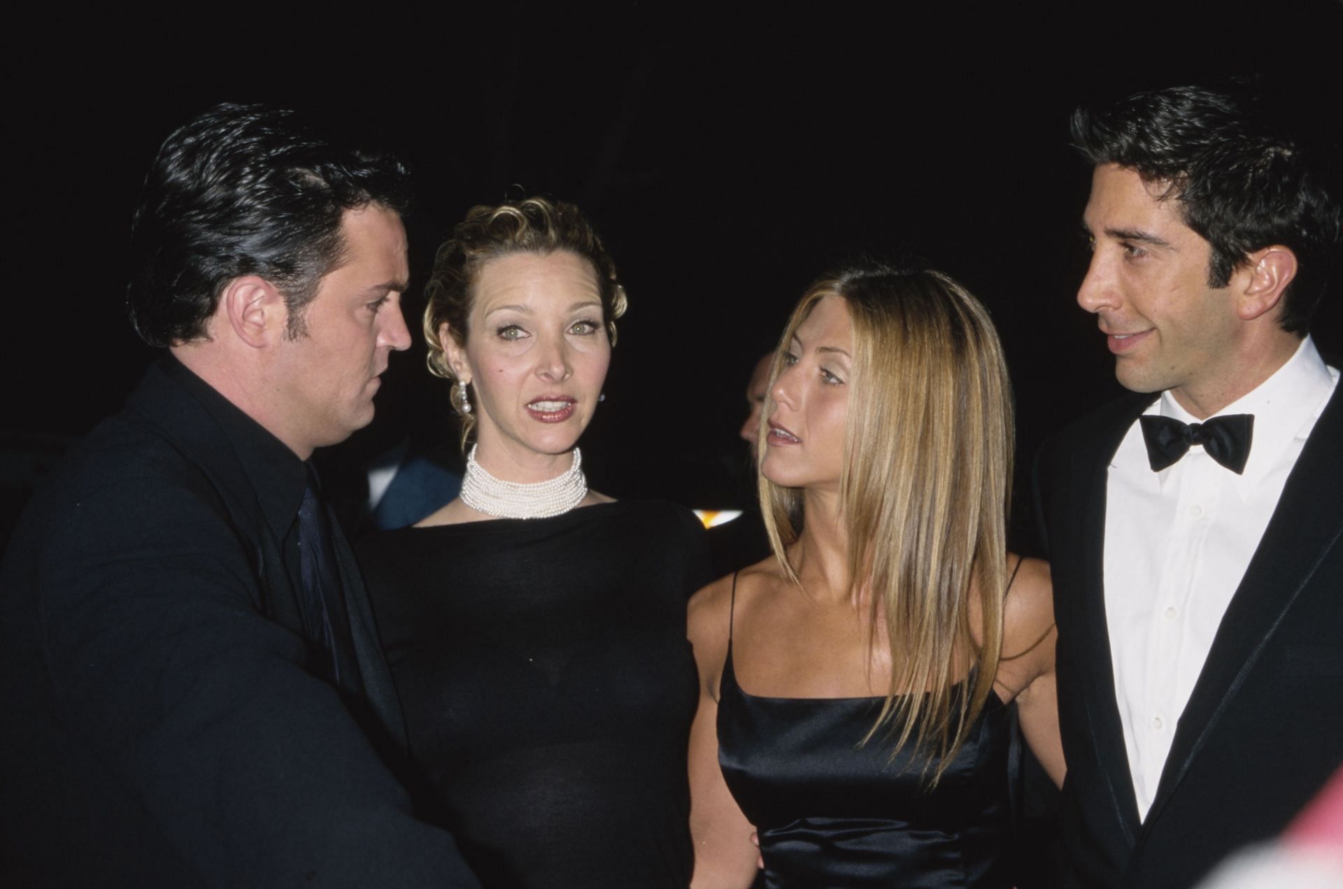 Perry with his Friends co-stars (Image via Getty)