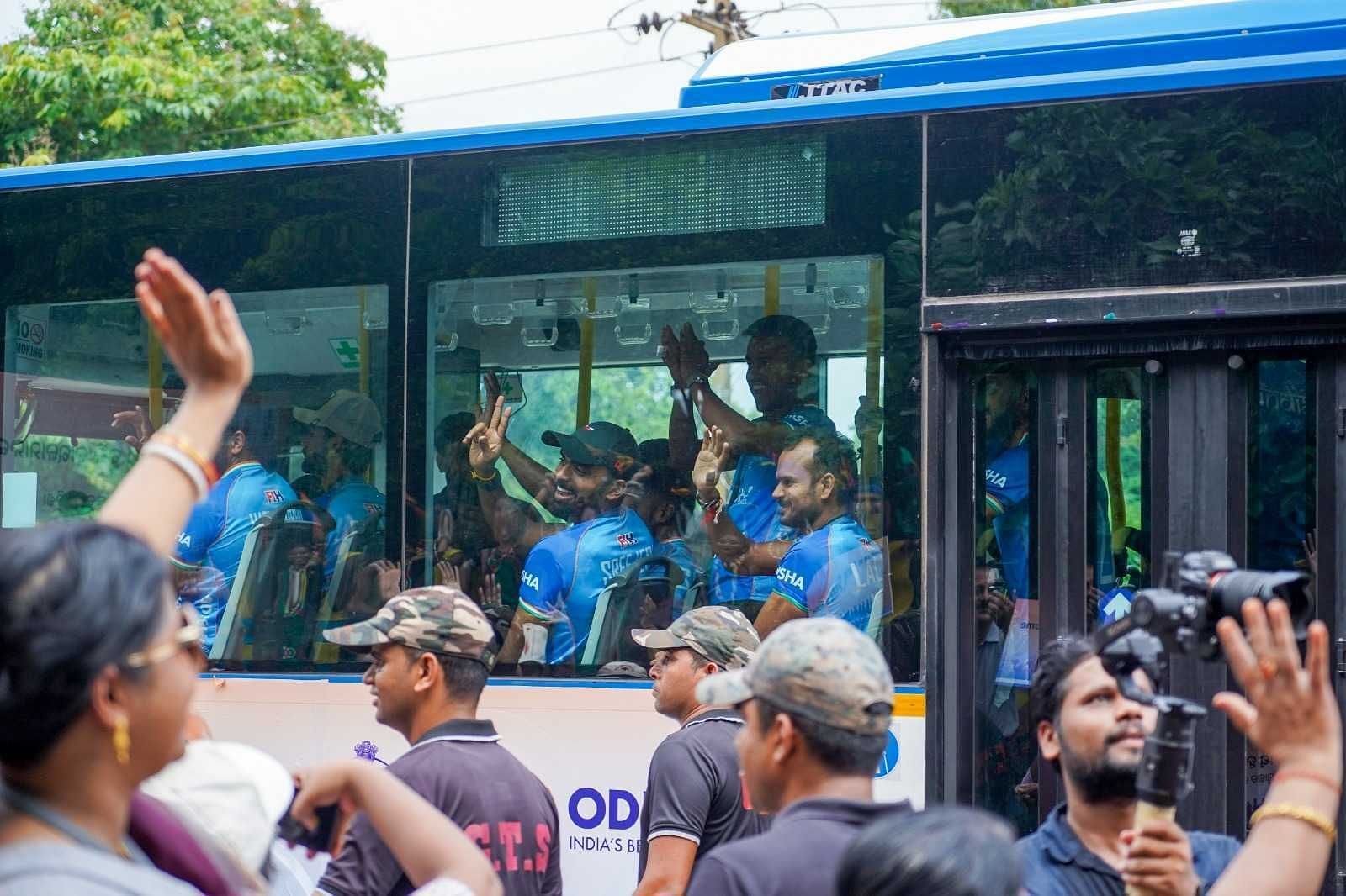 Members of the Indian men's hockey team wave to the Bhubaneswar crowd (Image via Hockey India)