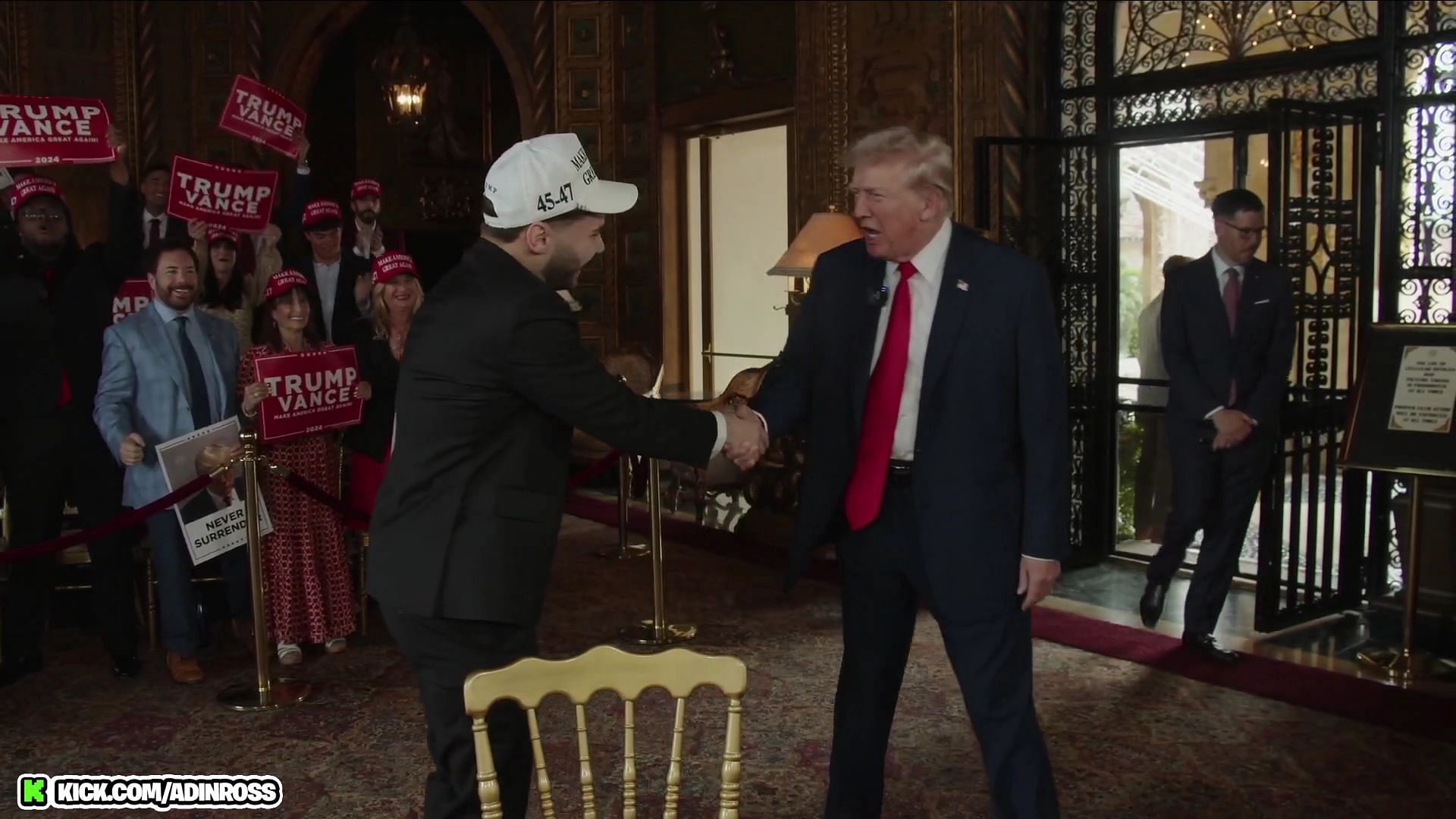 Adin and Trump shake hands while the 50 Cent song plays in the background (Image via Adin Ross/Kick)