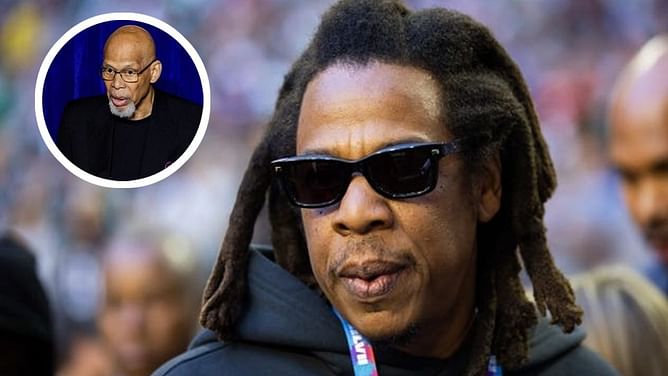 Photo: Kareem Abdul-Jabbar keeps it casual as he links arms with rapper Jay-Z at Fanatics fest