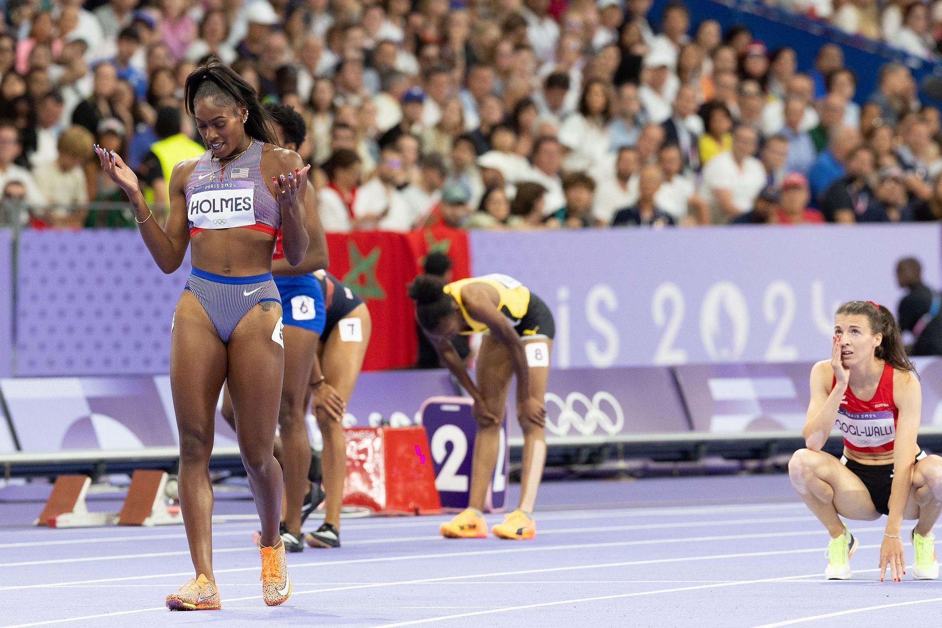 Alexis Holmes reacts after qualifying for the finals of the womens 400m at the Paris Olympics 2024 [Image Sources: Getty]