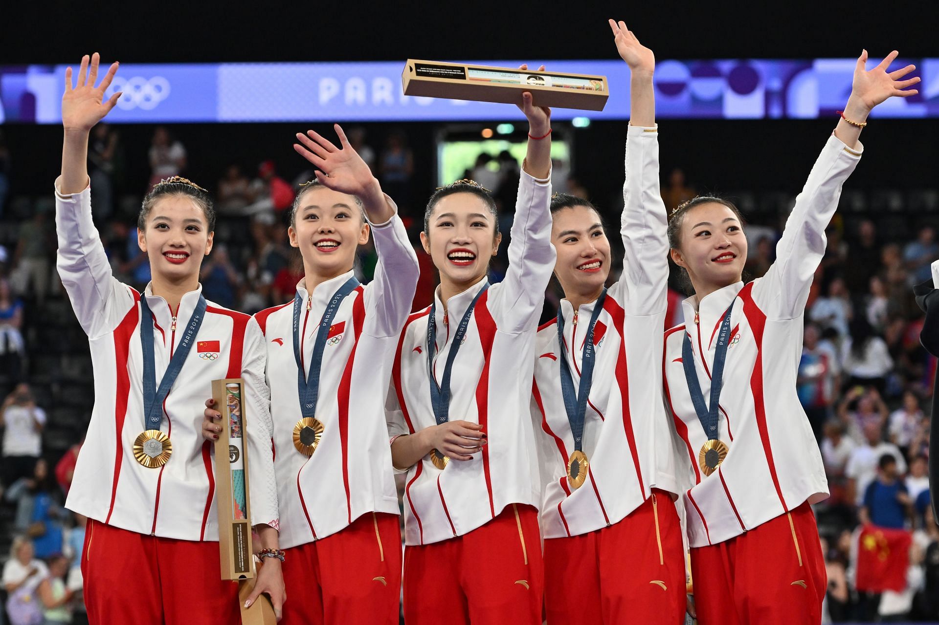 How did Russian gymnast help China win its first gold in group Rhythmic