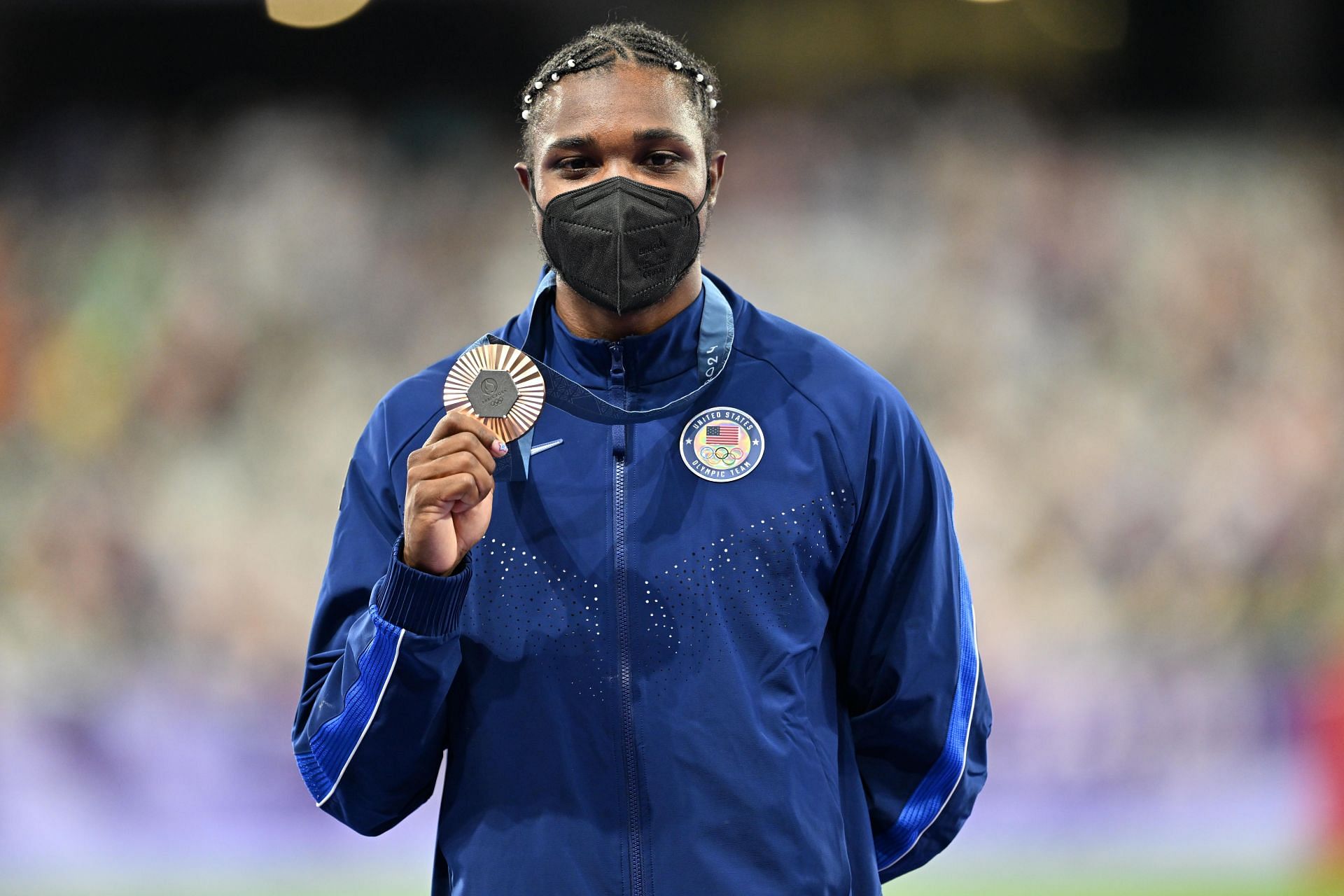 Noah Lyles celebrates on the podium during the Men&#039;s 200m medal ceremony at the Olympic Games 2024 in Paris, France. (Photo via Getty Images)