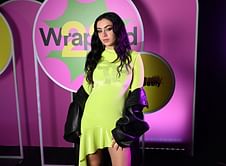"SO THAT TAYLOR REMIX IS REALLY COMING????" — Internet reacts to Charli XCX's photoshoot featuring bloody friendship bracelet