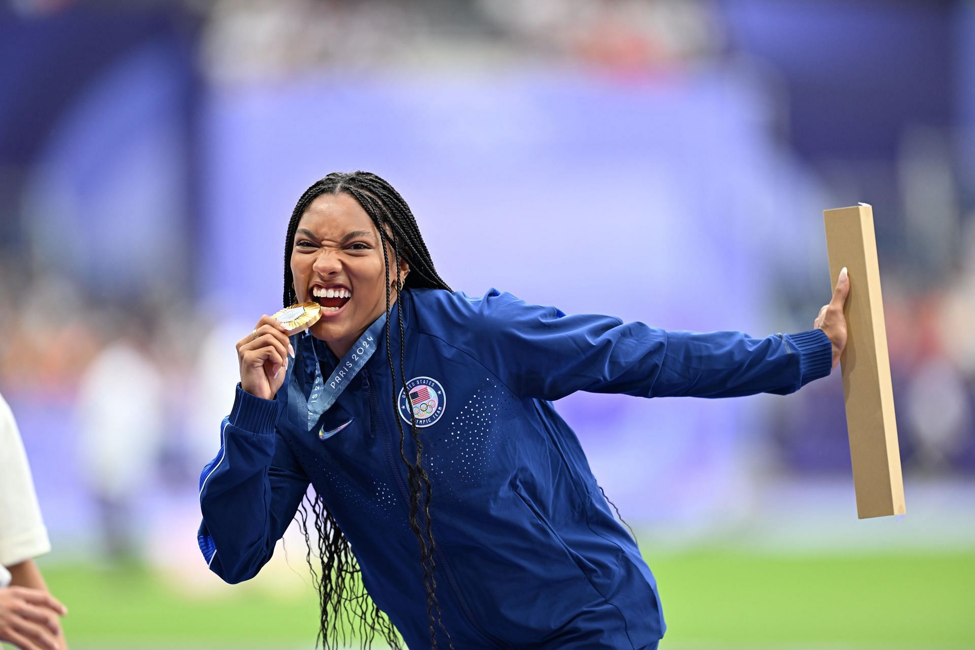 Tara Davis-Woodhall shows off her gold medal at the Paris Olympics  (Source: Getty)