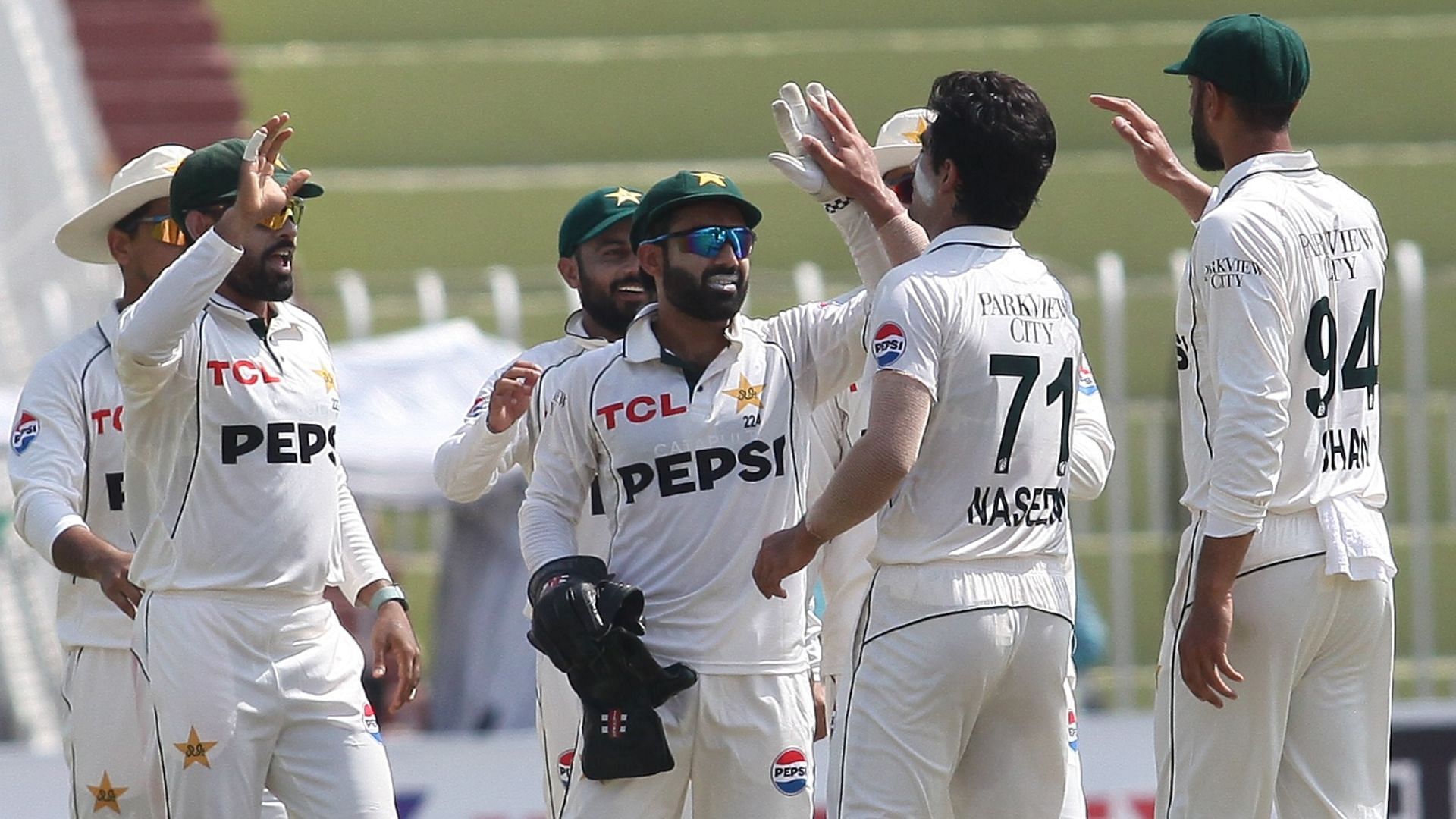 Pakistan's fielders gather around to celebrate the wicket of Zakir Hasan on Day 3 of PAK vs BAN 2024 1st Test (Image credits: @TheRealPCB on X)