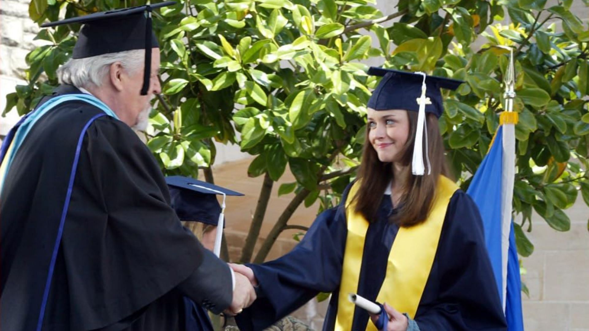 Still of Rory graduating (Image via Dorothy Parker Drank Here Productions, Hofflund/Polone, Warner Bros. Television)