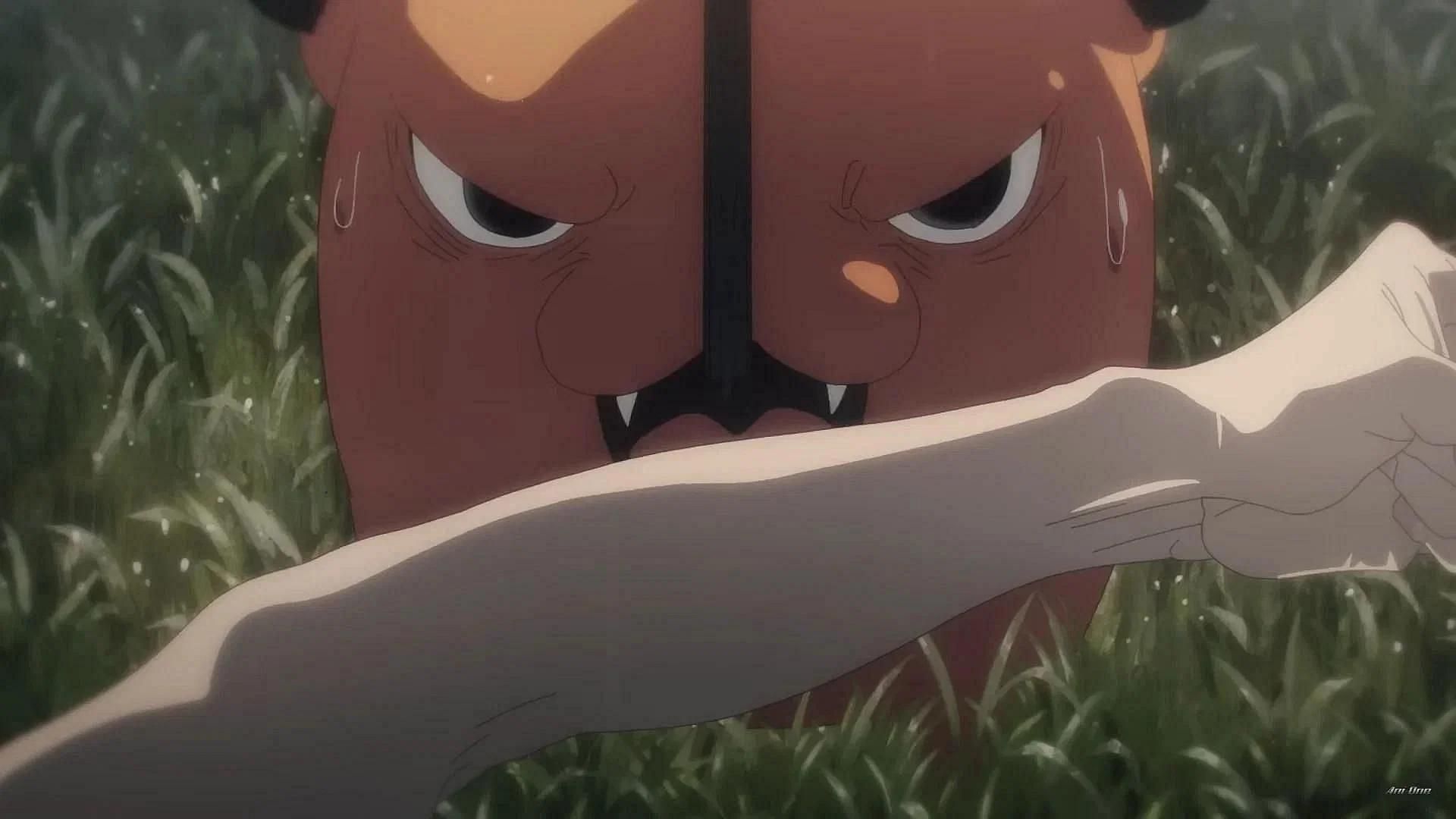 Pochita biting Denji&#039;s hand as shown in the anime (Image via MAPPA)