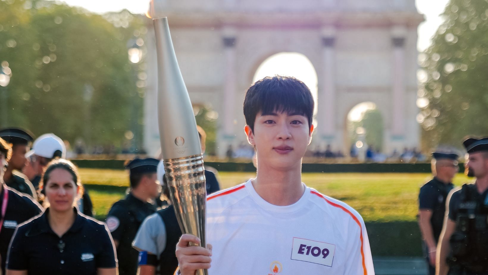 BTS&#039; Jin at the 2024 Paris Olympics Torch Relay. (Image via X/@Paris2024)