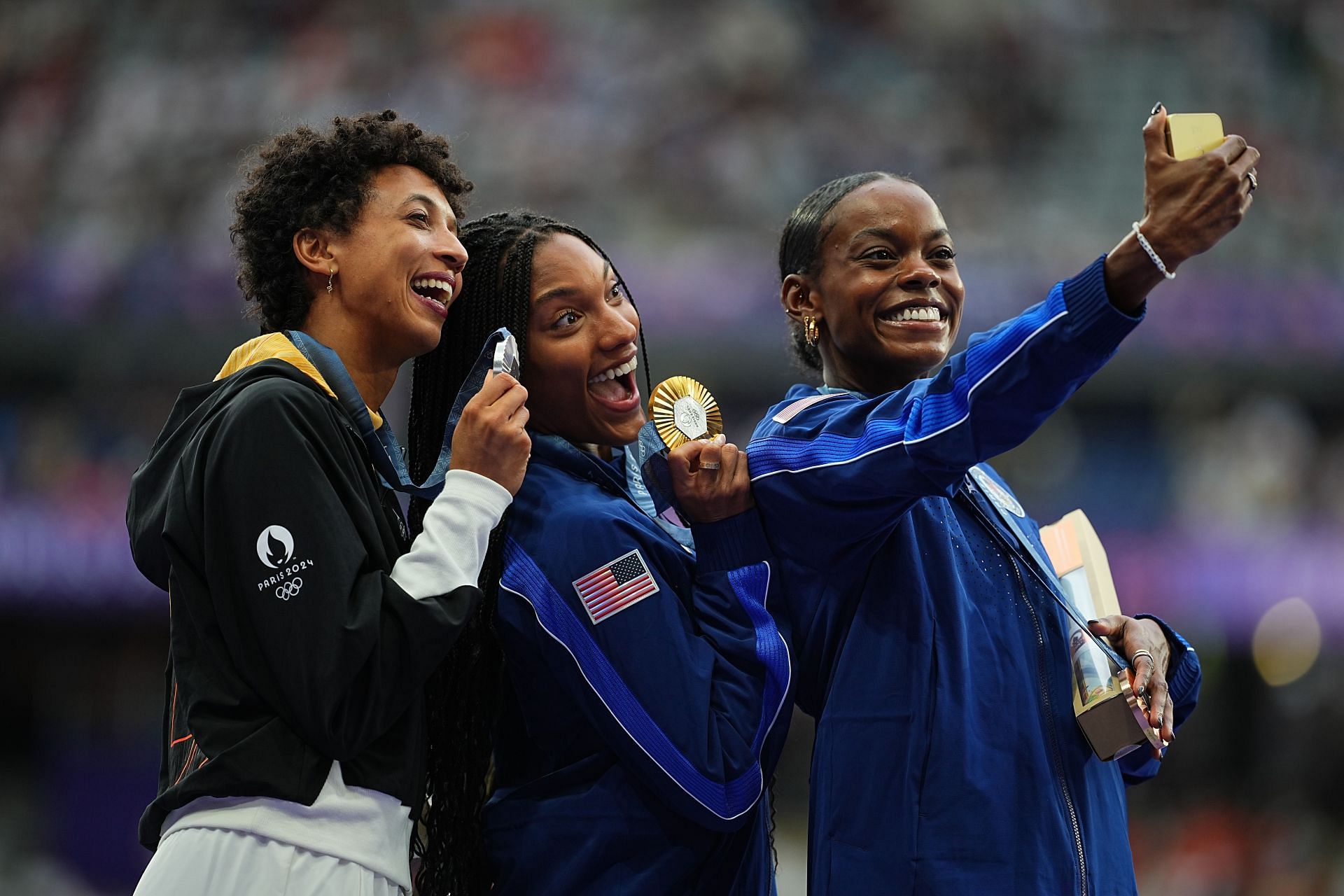 Jasmine Moore of USA takes a selfie with the other two long jump medalists at the Paris Olympics, Tara Davis-Woodhall of USA and Malaika Mihambo of Germany [Image Source : Getty]