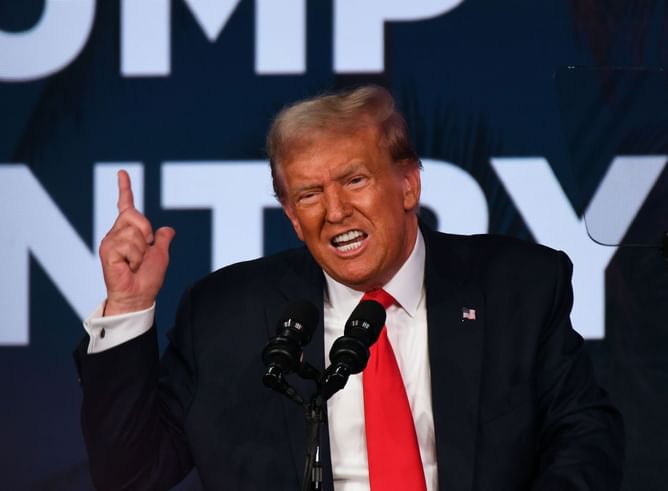 "Hawk Tuah punching the air rn" — Internet reacts to Trump claiming Elon Musk endorsed him "full-throated" in Mar-a-Lago speech
