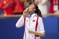 Zheng Qinwen became the first Asian tennis player to win women’s singles gold - Getty Images