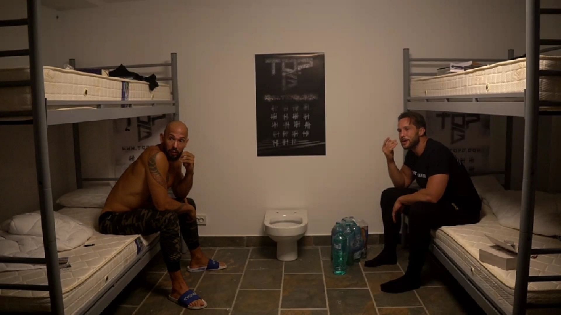 In August 2024, Andrew and Tristan Tate did an episode of &quot;Tate Speech&quot; on a jail-themed set, sharing stories of their time detained in a Romanian cell (Image via Tate Speech by Rumble/Andrew Tate)