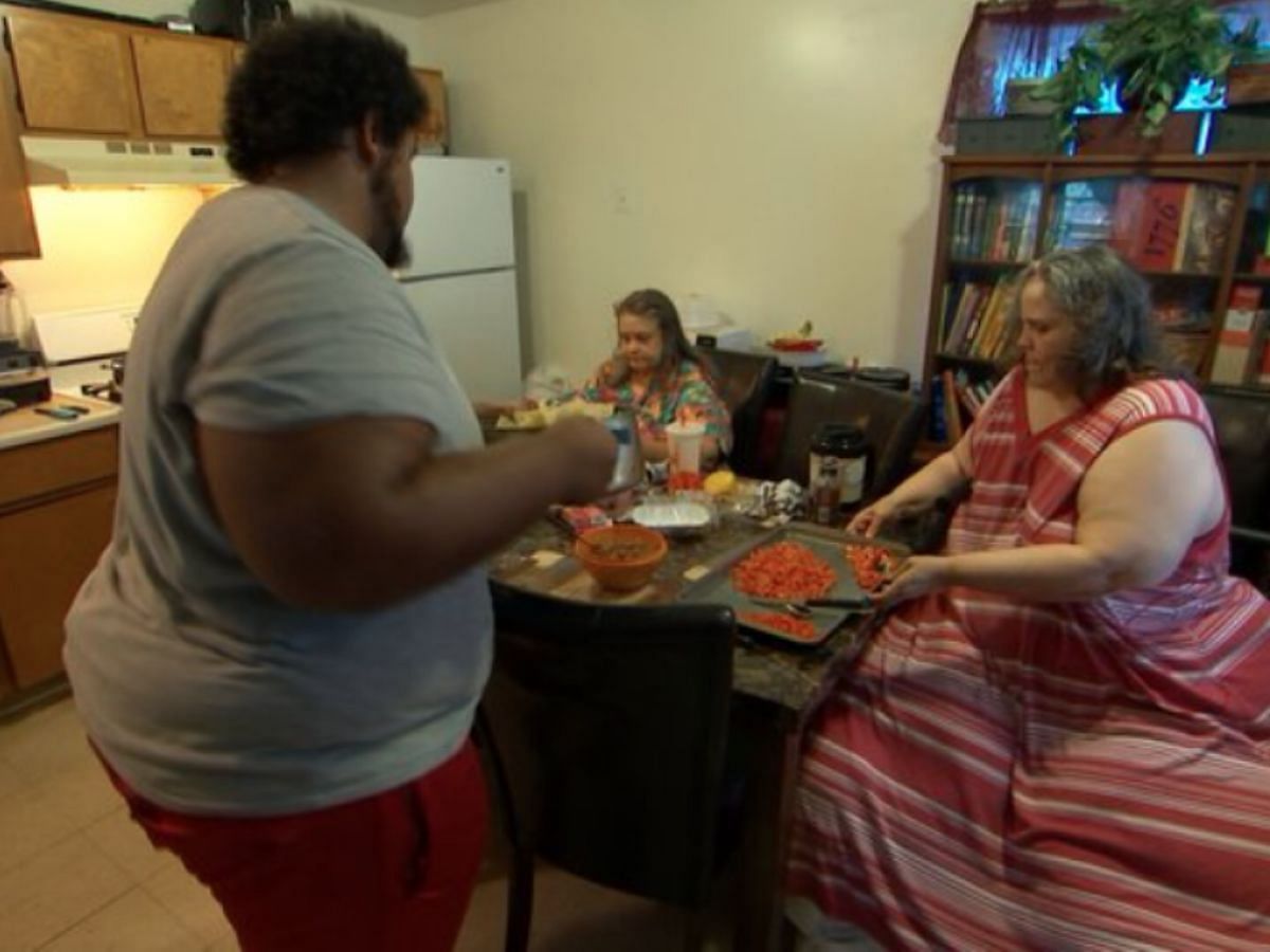 Tracey cooks a meal with her family. (Image via TLC)