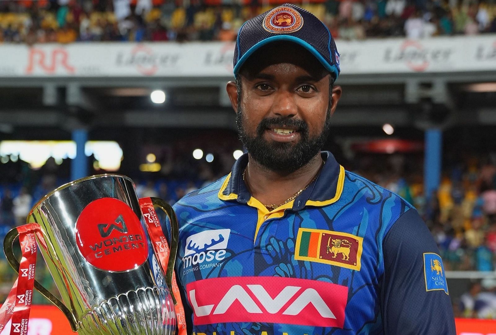 Charith Asalanka with the India-Sri Lanka series trophy. (Source: Getty)