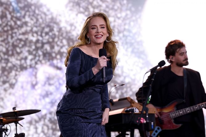 "This scene was so fit for a movie" — Internet reacts to Adele performing in torrential rain during Munich residency