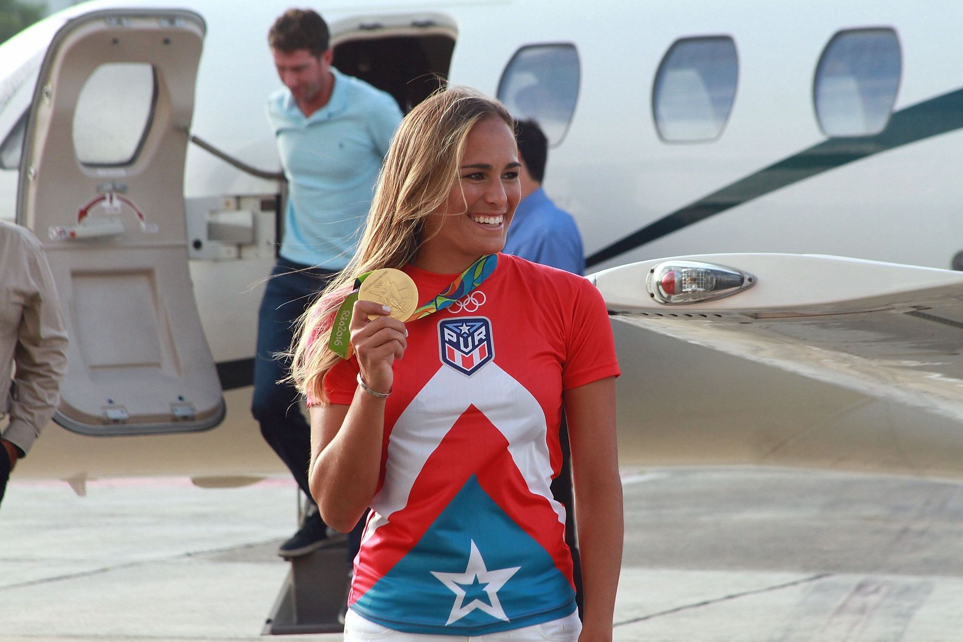 Monica Puig arrives in Puerto Rico. (Image via Getty).