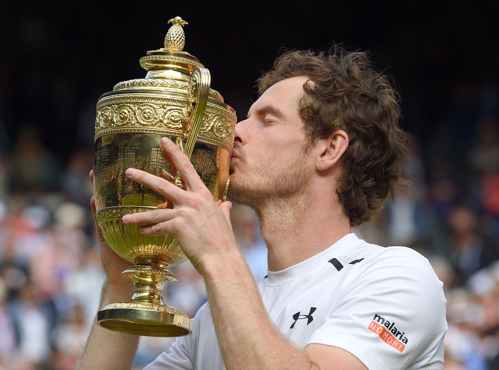 Andy Murray poses with the Wimbledon trophy in 2016