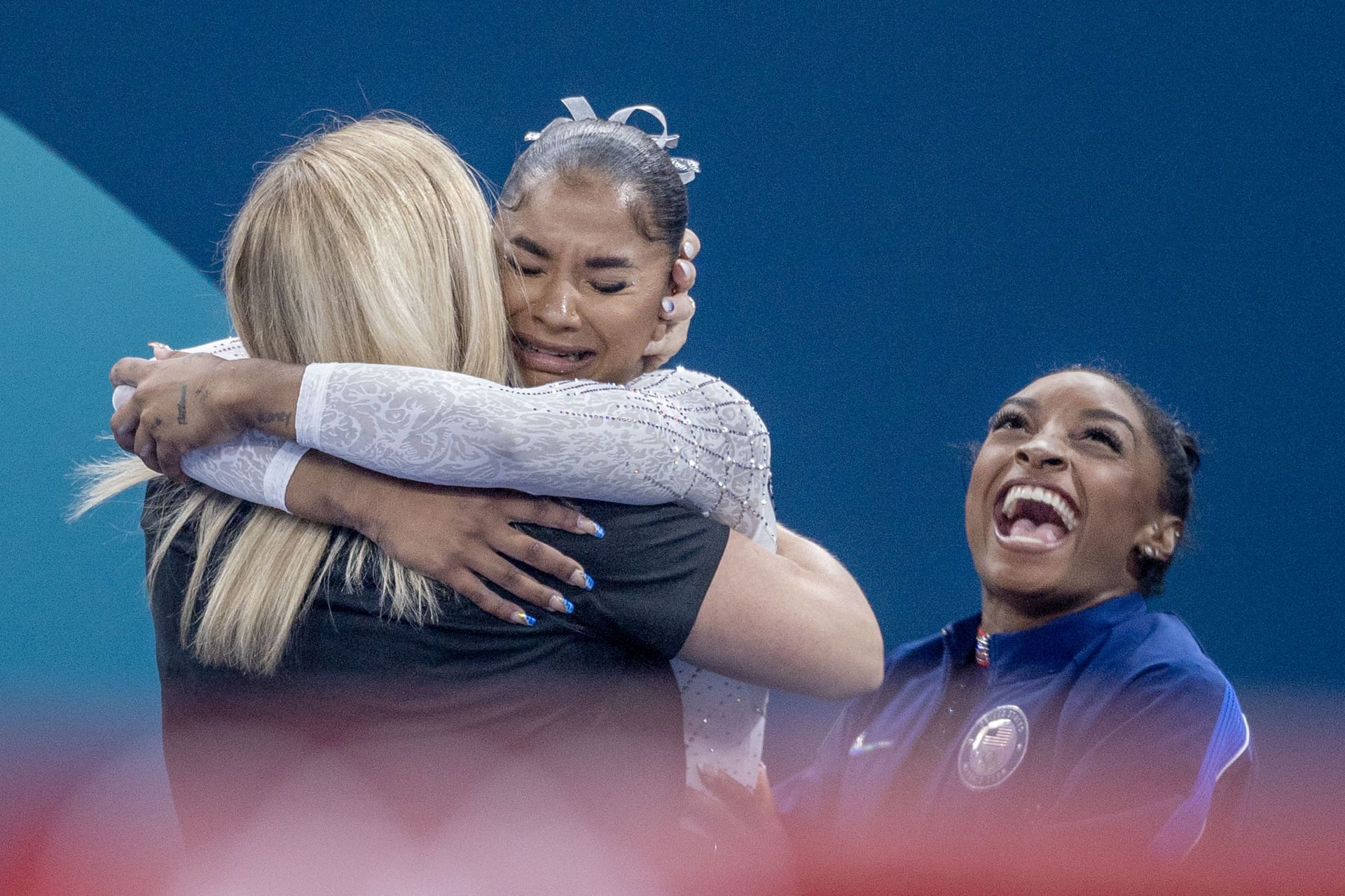 Jordan Chiles (C) hugs Cecile Landi as Simone Biles celebrates after the Floor Exercise finals at the Paris Olympics 2024 [Image Source: Getty]