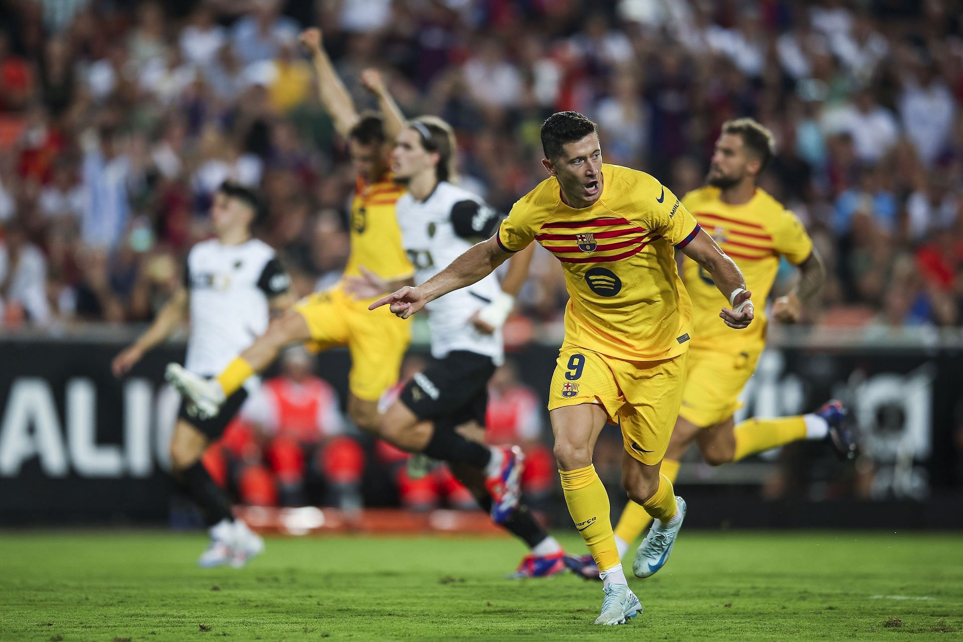 Barcelona  striker Robert Lewandowski rejoices.