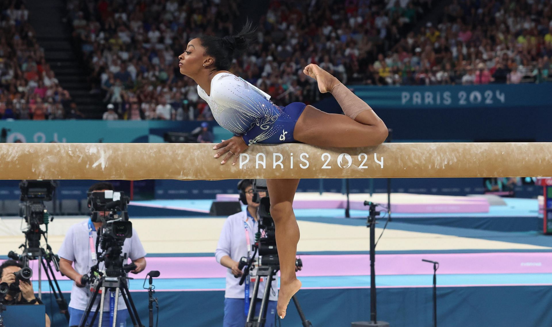 Simone Biles during a beam balance performance at the 2024 Summer Olympics (Image via Getty)