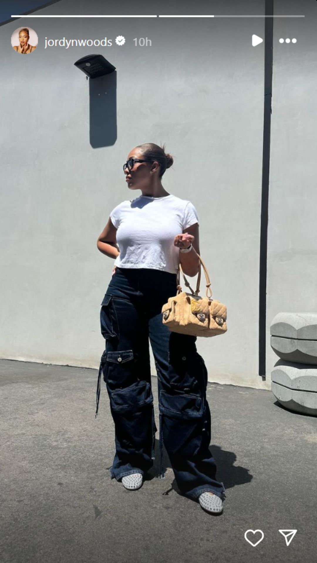 Woods makes a style statement with her Chanel handbag (Image: Jordyn Woods Instagram story)