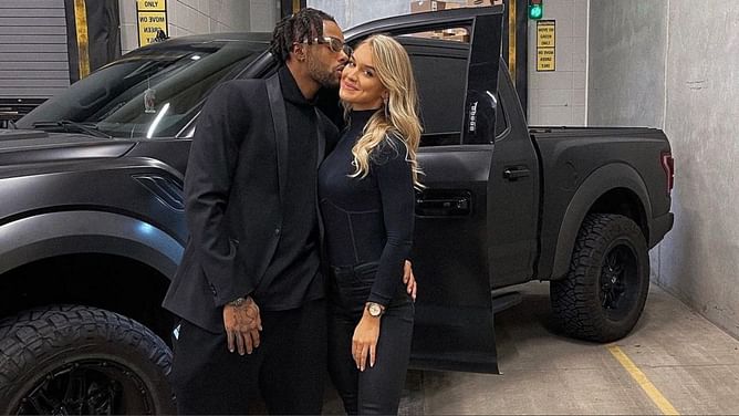 D'Angelo Russell shares a selfie kiss with girlfriend Laura Ivaniukas as they enjoy 'mom & dad's' night out