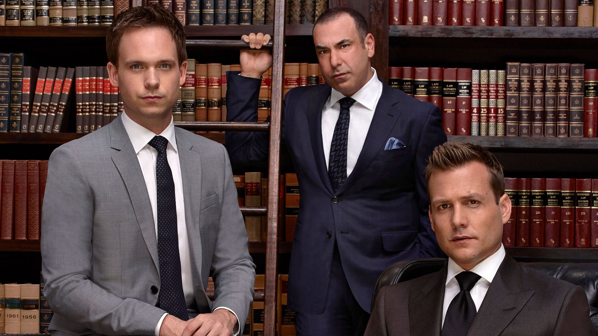 Patrick J. Adams, Gabriel Macht, and Rick Hoffman in Suits (image via USA Network)