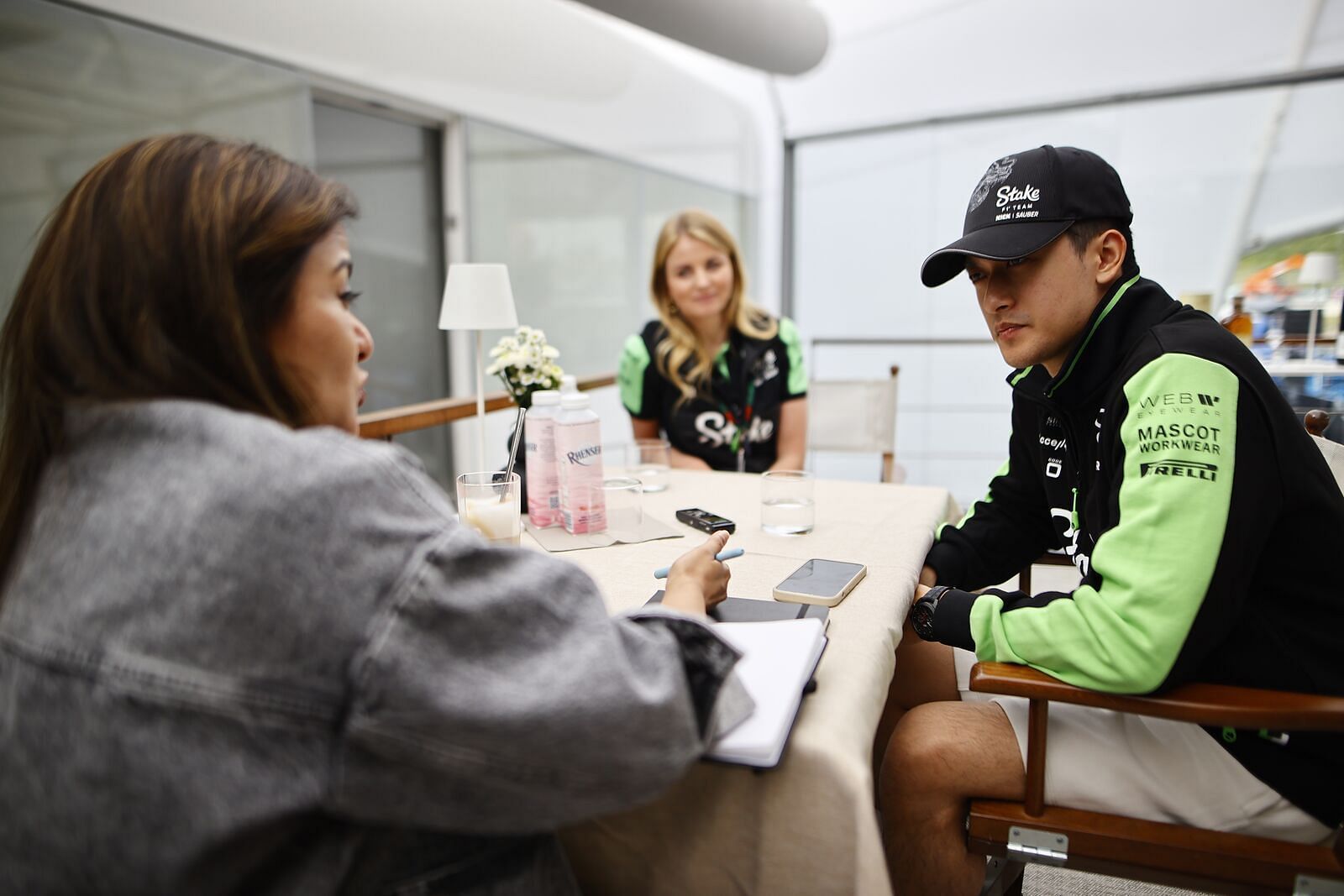  Zhou Guanyu chats with Niharika Ghorpade from Sportskeeda at the Kick Stake F1 team motorhome in Zandvoort, Netherlands. (Image courtesy: Sauber media hub / Andy Hone)