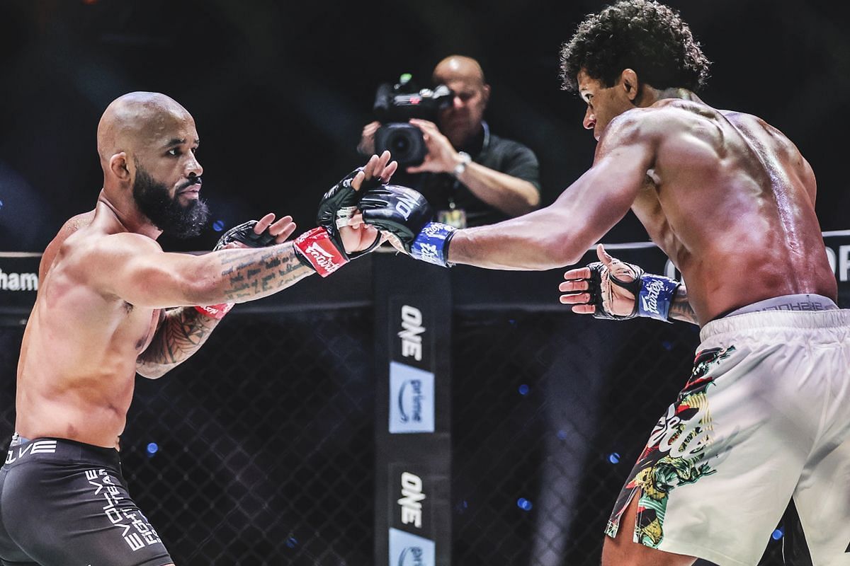 Adriano Moraes (right) handed Demetrious Johnson (left) his first career loss via knockout in April 2021. [Photo via: ONE Championship]