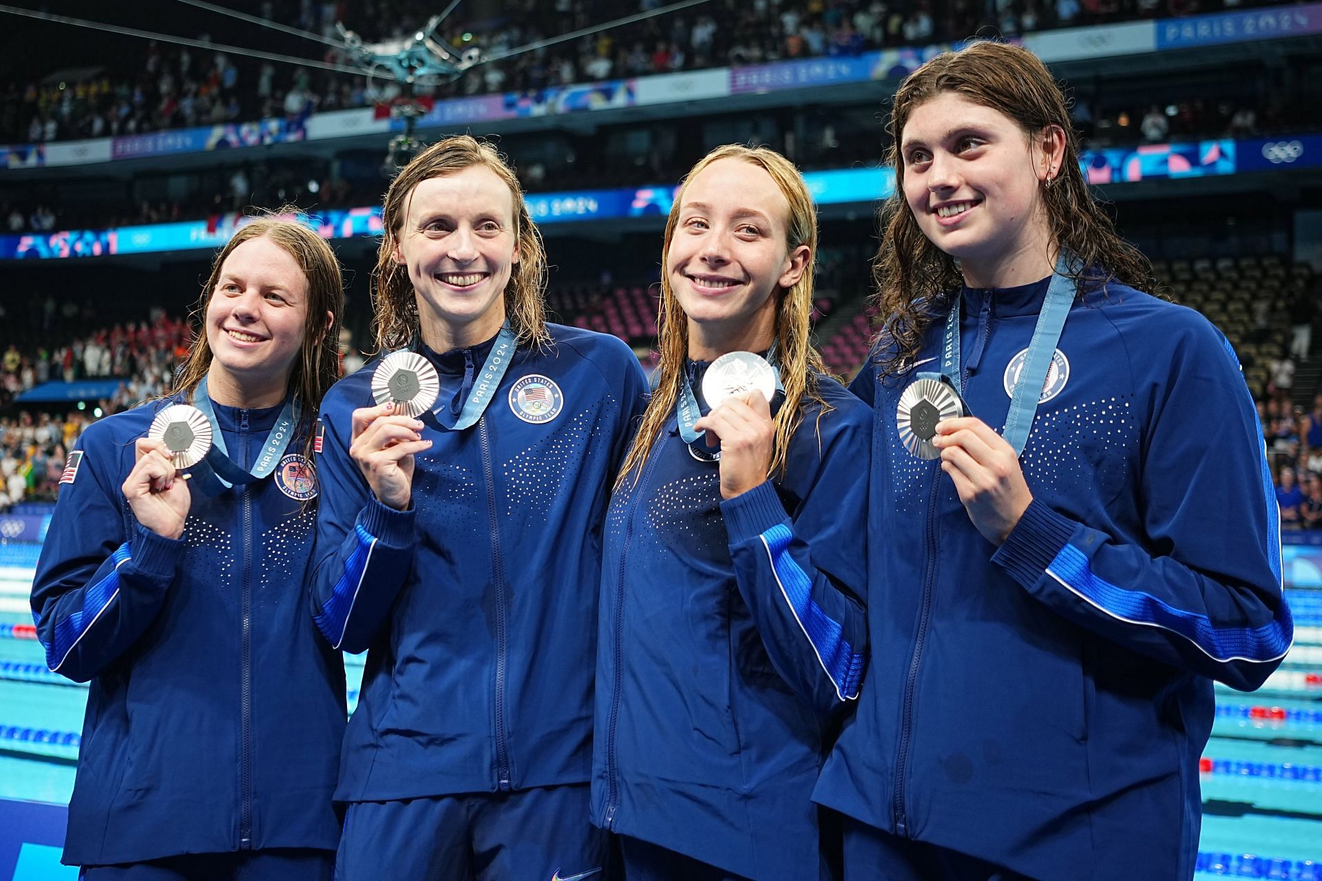 Katie Ledecky with the rest of the team after winning the silver medal in women&#039;s 4x200m freestyle relay event at the Paris Olympics [Image Source: Getty]