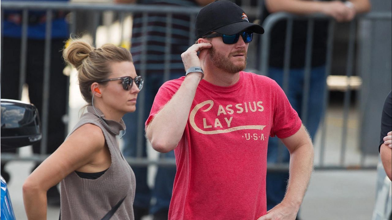 Amy Earnhardt (L) with her husband Dale Earnhardt Jr. (R), (Source: Imagn)