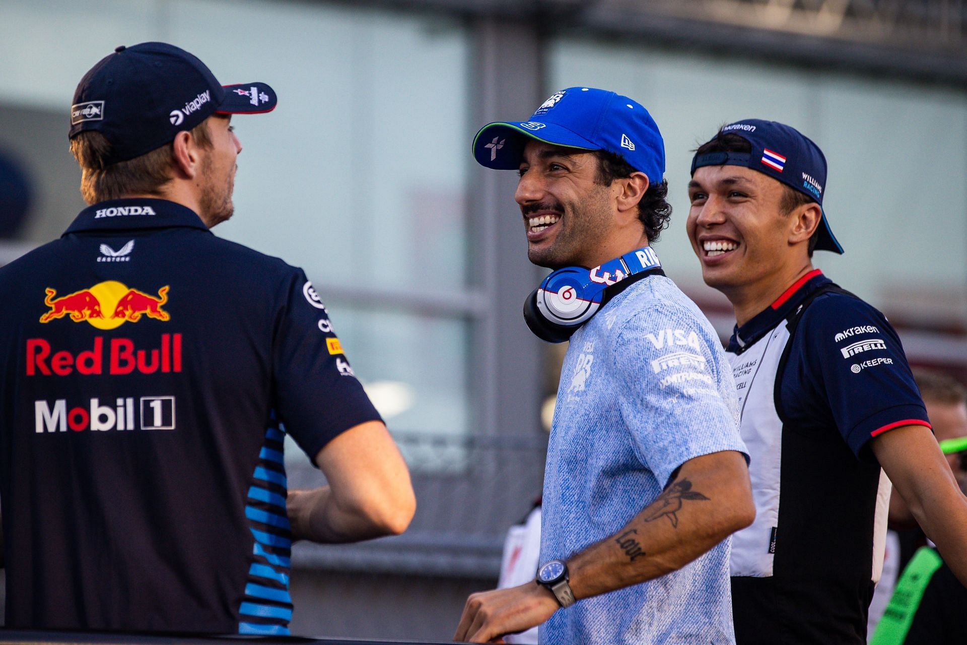 Daniel Ricciardo and Max Verstappen share a laugh during the drivers' parade at the F1 Grand Prix Of Singapore. Source: Getty Images