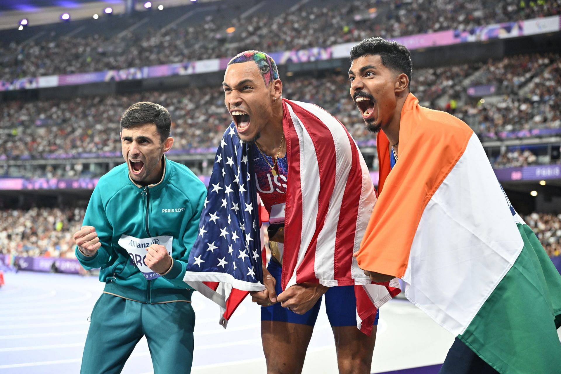 Gold medalist Roderick Towsend, silver medalist Nishad Kumar and bronze medalist Georgii Margiev celebrate after the men&#039;s high jump T47 event at the Paris Paralympics 2024 [Image source: Getty]