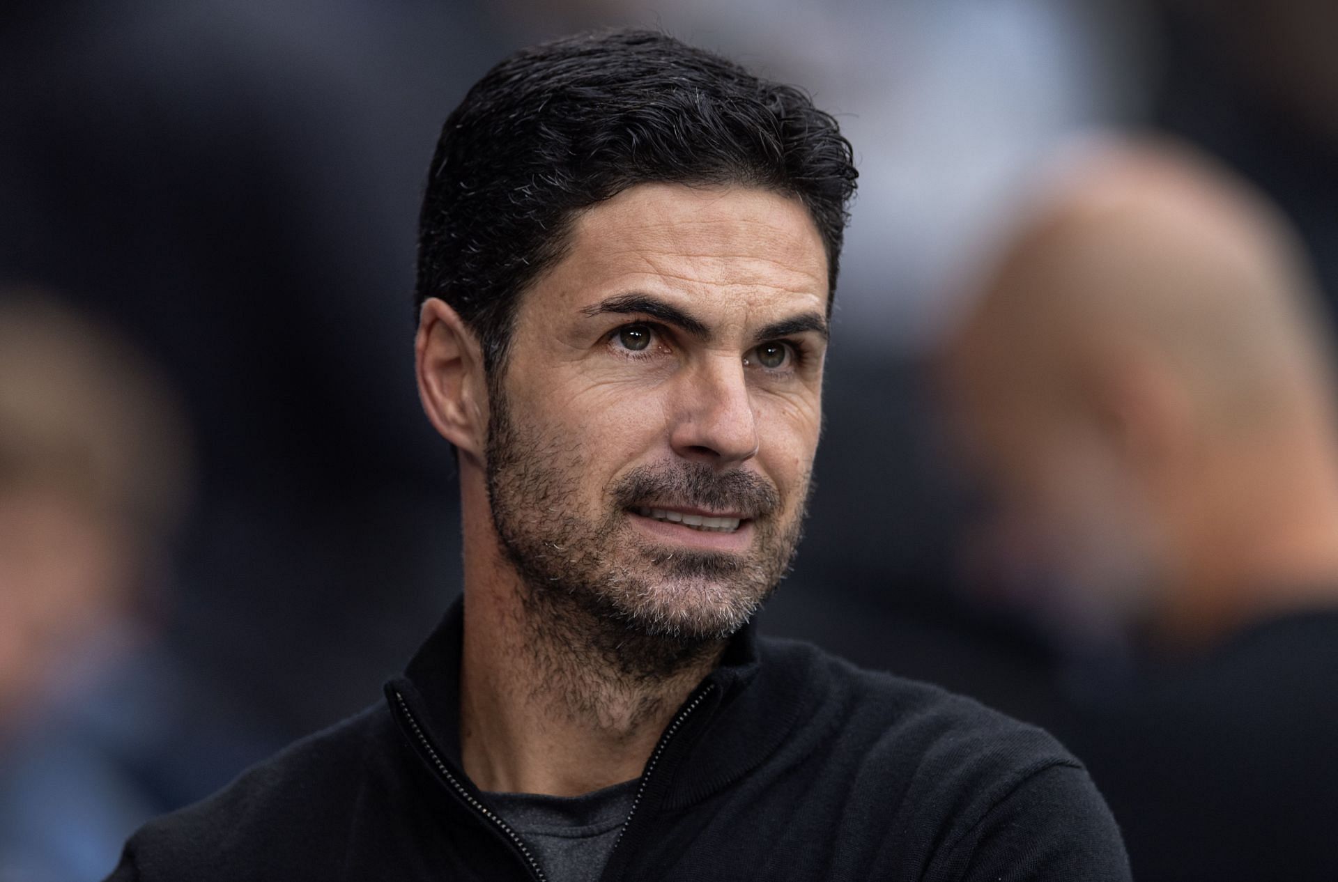 Mikel Arteta doesn't appear to be too insulted by the Manchester City star (Image - Getty)