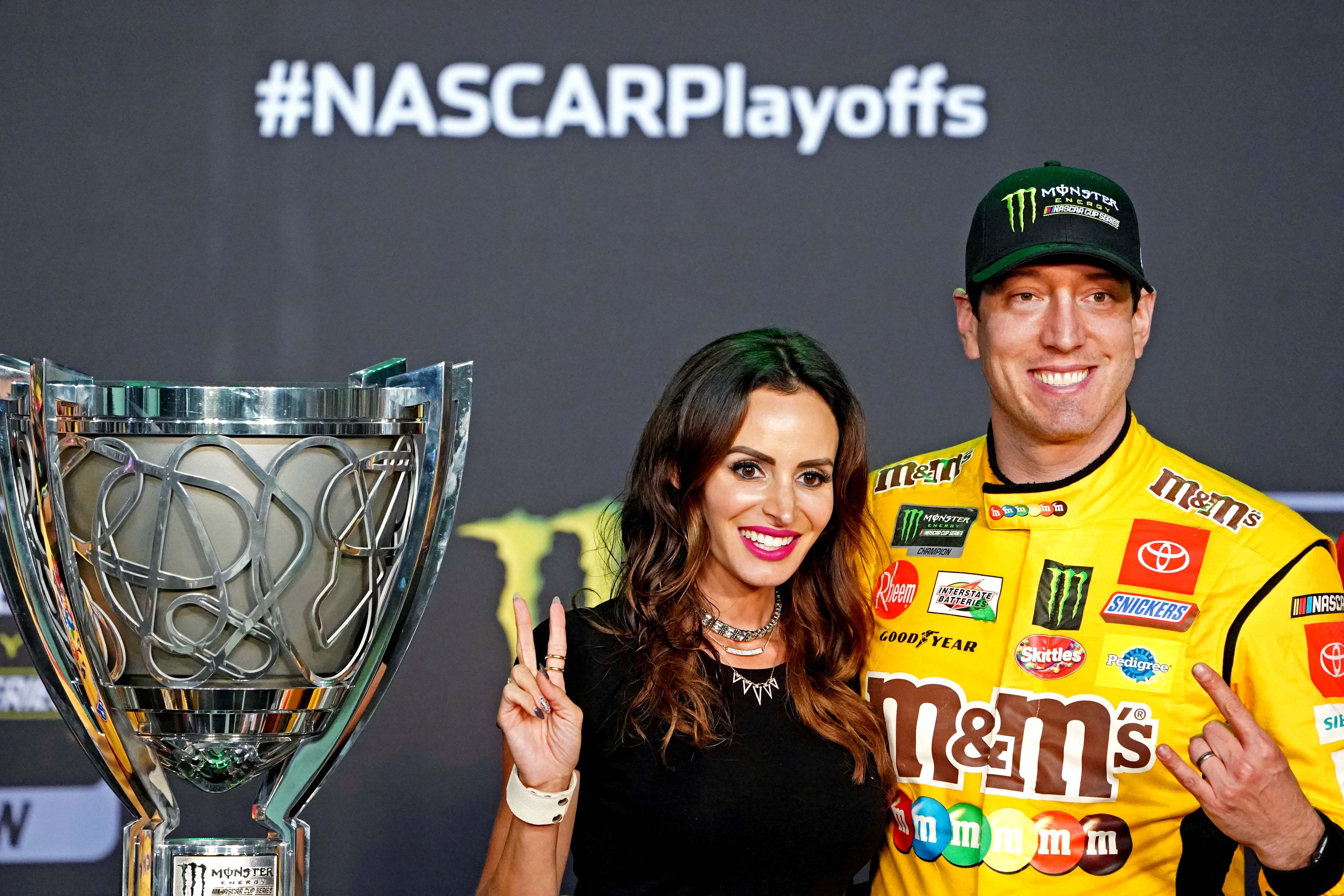 NASCAR Cup Series driver Kyle Busch celebrates after winning the 2019 NASCAR Series Cup Championship with his wife Samantha Busch (Source: Imagn)