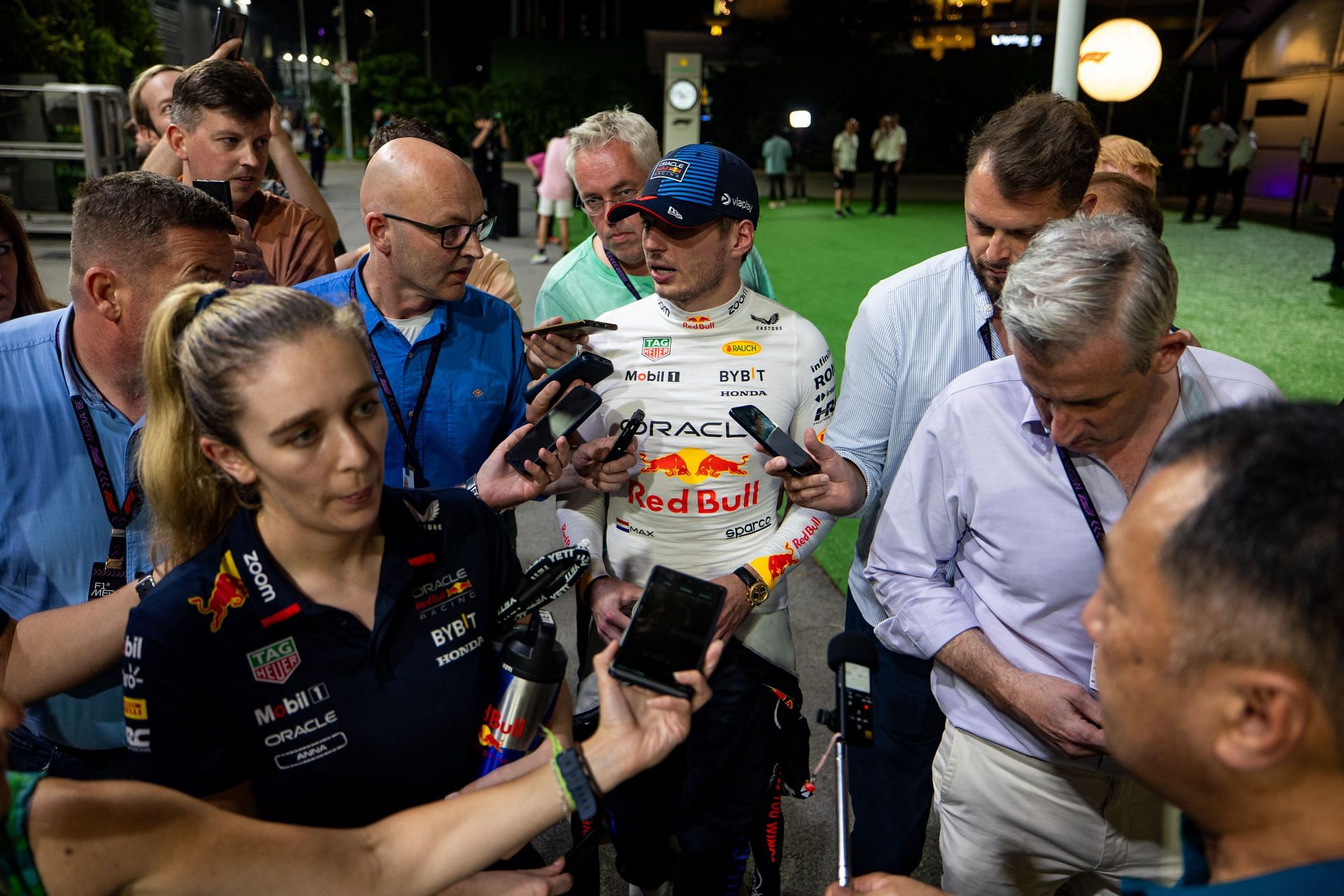 A group of journalists surround Max Verstappen after he gave blunt and short answers. Source: Getty Images